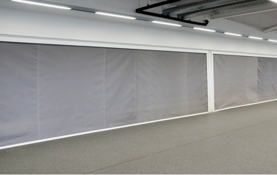 What is the difference between a smoke curtain and a smoke barrier
